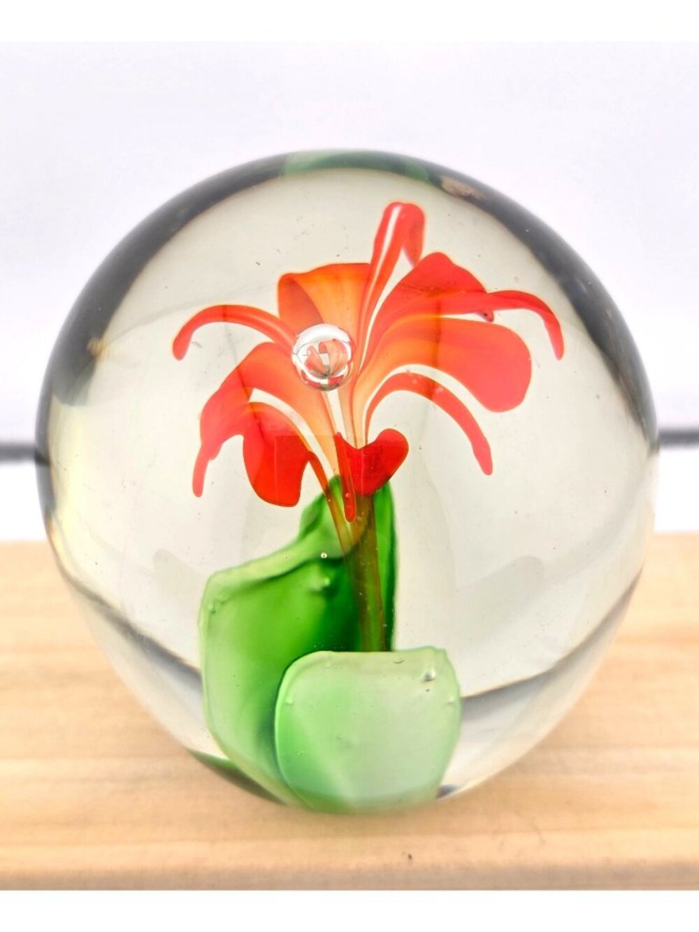 Handcrafted Clear Glass Paperweight With Orange Flower Design & Green Leaves - Picture 2 of 15